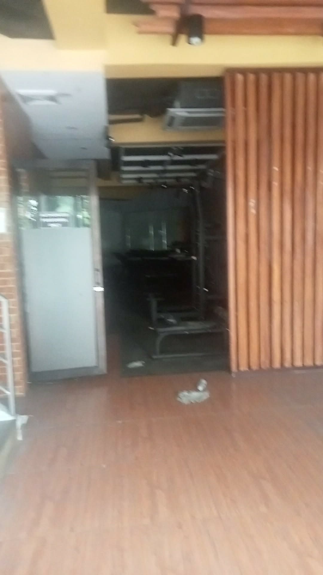 Frontage of the same fitted unit, gym equipment visible through the doorway