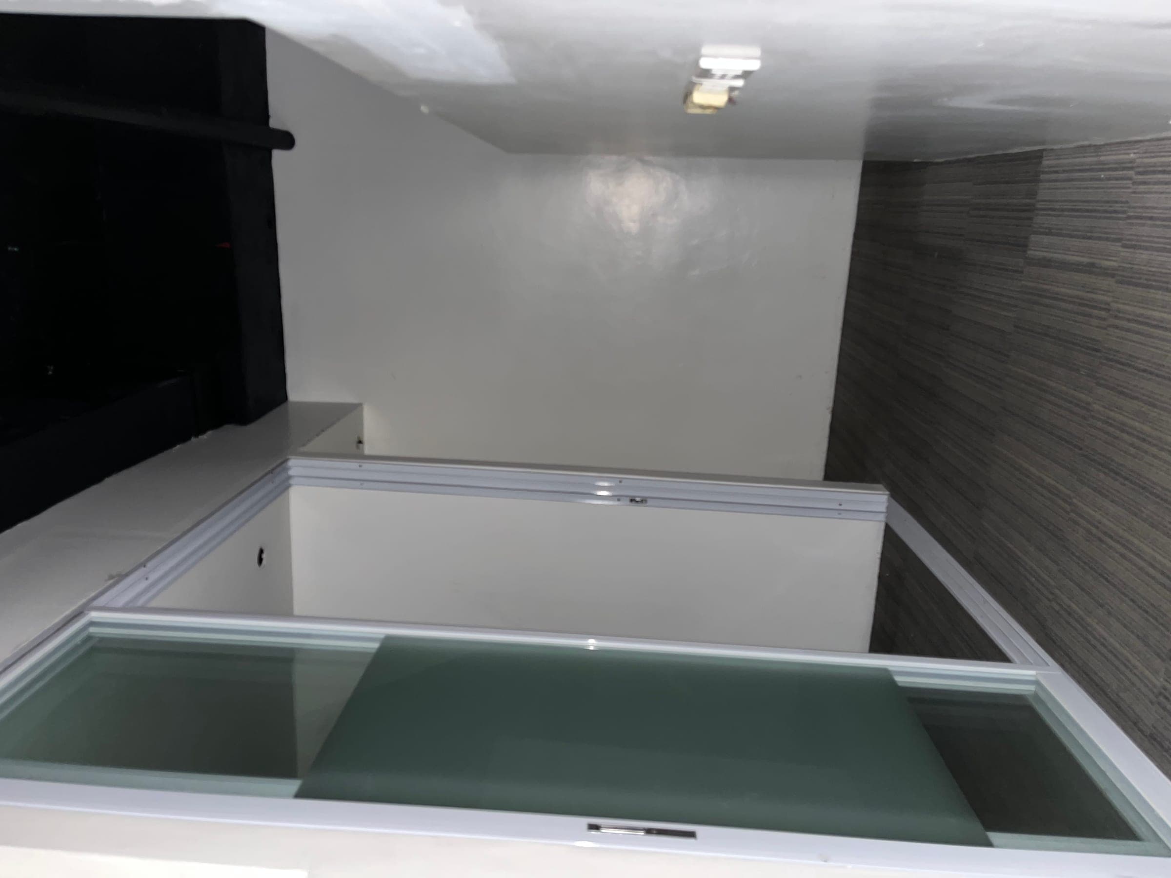 Glass partition and exposed services above