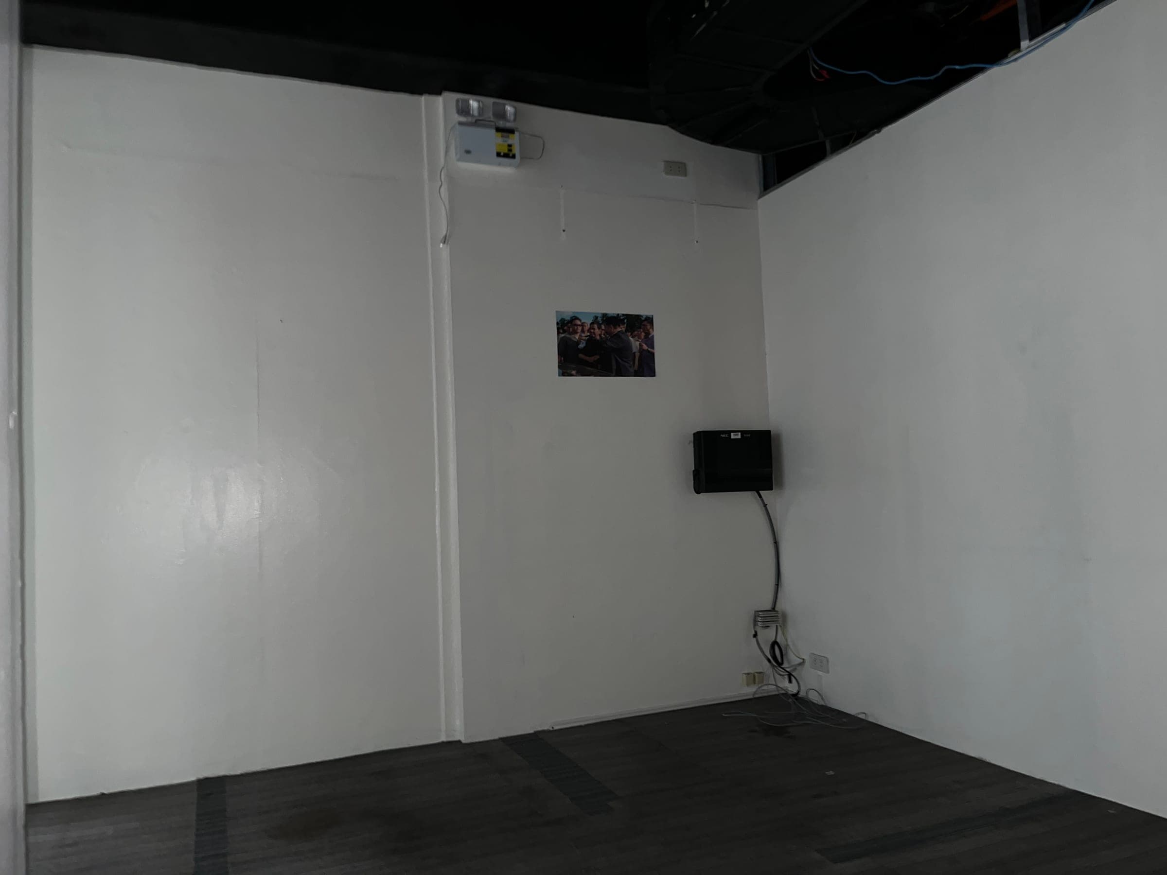 Open floor area with services exposed overhead